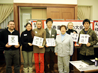 Group photo, participants holding their own work