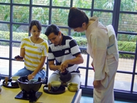 Participant pouring hot water into the tea bowl