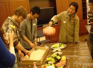 Picture of participants making ‘sushi-meshi’ (rice seasoned with vinegar specially)
