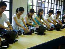 Participants experiencing Japanese tea ceremony