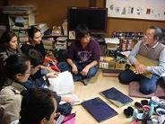 Picture of the participants paying attention to the explanation about wood block printing