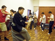 Participants learning some movements of a scene from the play ‘Busu’ 