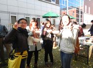 Participants enjoying mochi and interacting with other participants