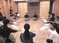 Participants practicing how to use a fan